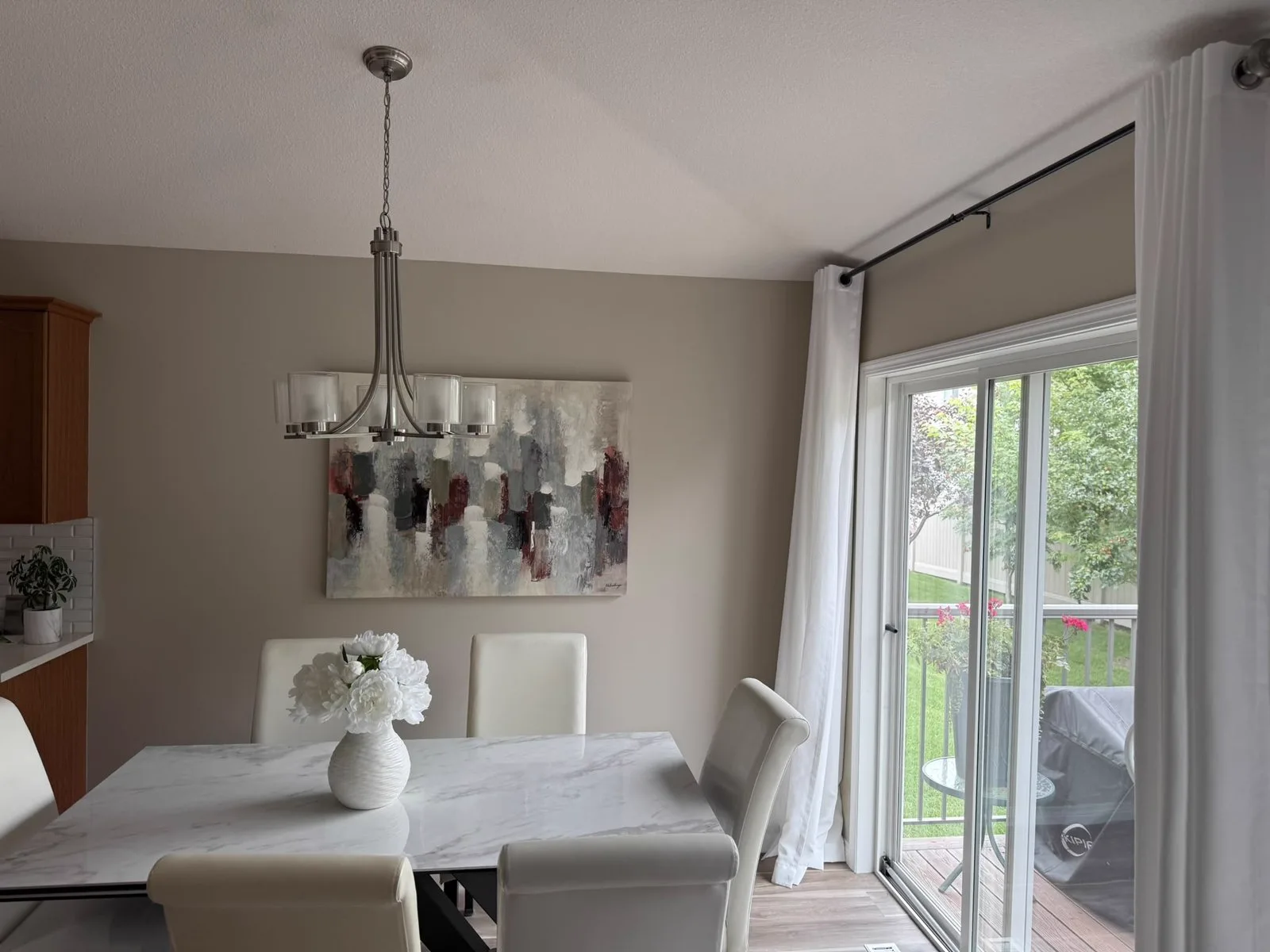 Dining area with freshly painted walls beside patio doors